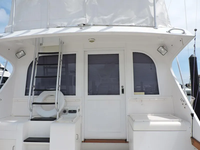 Slide: The Image of 1990 Post 44 Sport Fisherman boat stern with ladder and door. - 8