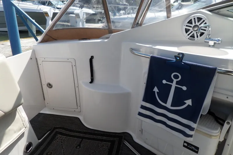 Slide: The Image of 2005 Chaparral Signature 270 boat interior with anchor-themed decor and speaker. - 11