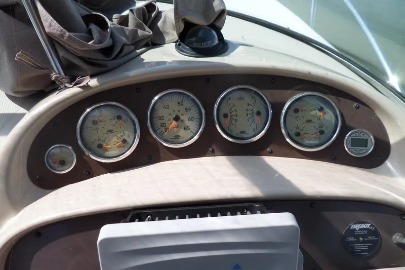 Slide: The Image of Dashboard of a 2005 Chaparral Signature 270 boat with gauges and controls. - 18