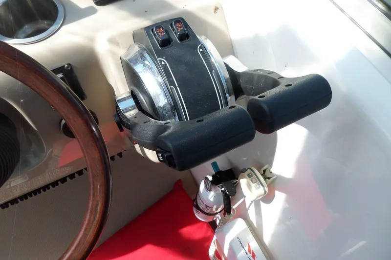 Slide: The Image of 2005 Chaparral Signature 270 boat controls and steering wheel close-up. - 21