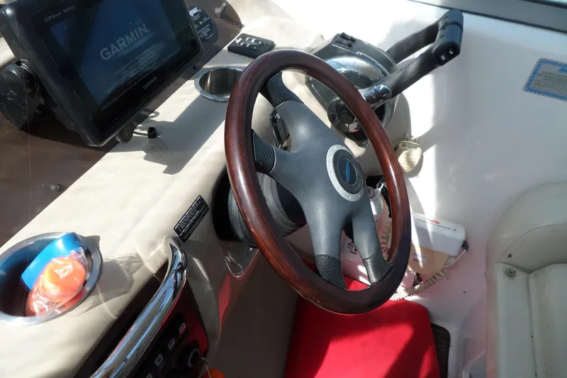 Slide: The Image of 2005 Chaparral Signature 270 helm with Garmin GPS and wooden steering wheel. - 24