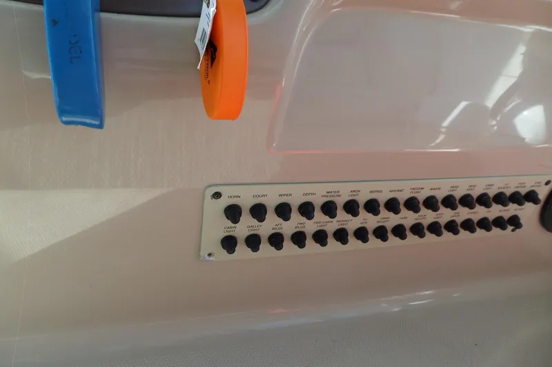 Slide: The Image of Control panel of a 2005 Chaparral Signature 270 boat with labeled switches. - 29