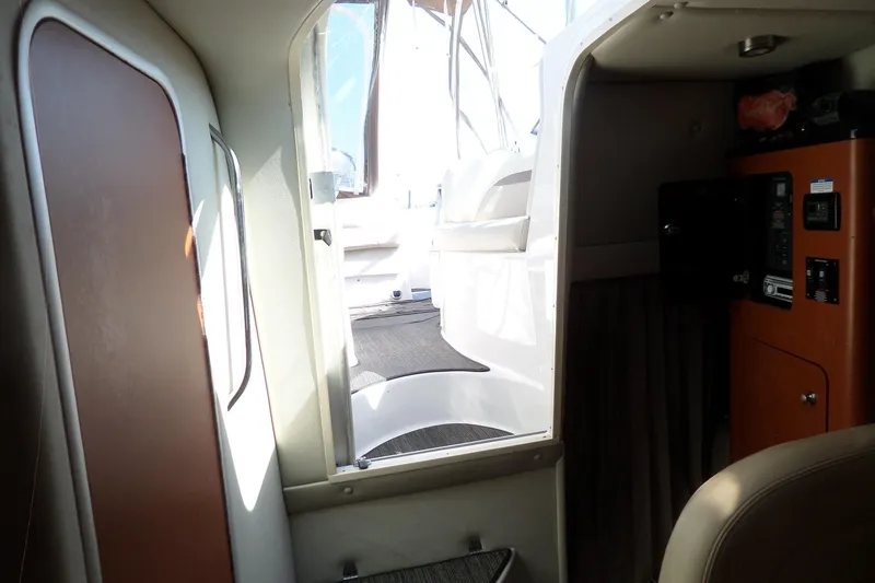 Slide: The Image of Interior view of 2005 Chaparral Signature 270 boat cabin with steps to deck. - 37