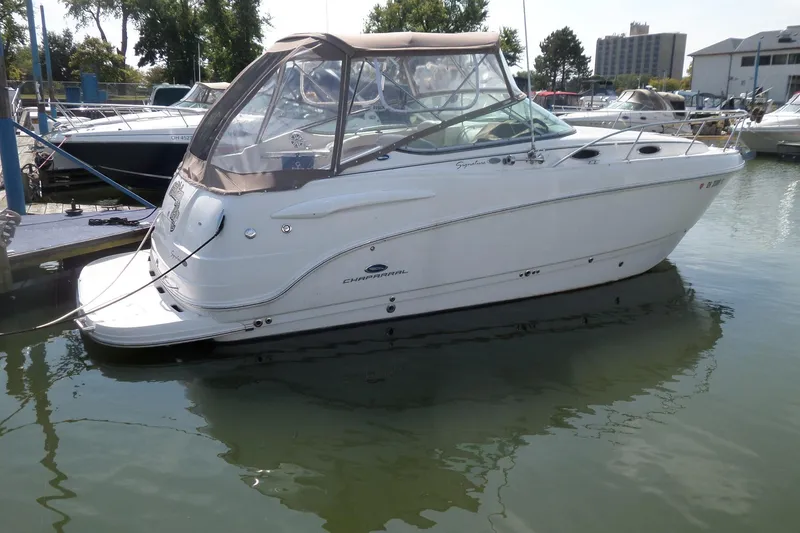 Slide: The Image of 2005 Chaparral Signature 270 boat docked in a marina, side view. - 4