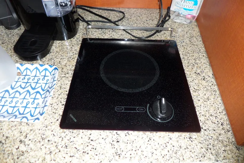 Slide: The Image of 2005 Chaparral Signature 270 kitchen with electric cooktop and coffee maker on granite countertop. - 45