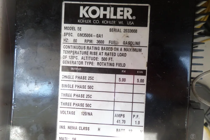 Slide: The Image of Kohler generator label on 2005 Chaparral Signature 270, model 5E, gasoline-powered. - 55
