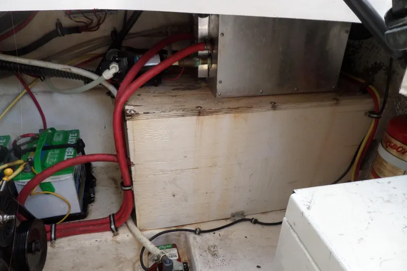 Slide: The Image of 2005 Chaparral Signature 270 engine compartment with wiring and battery setup. - 56