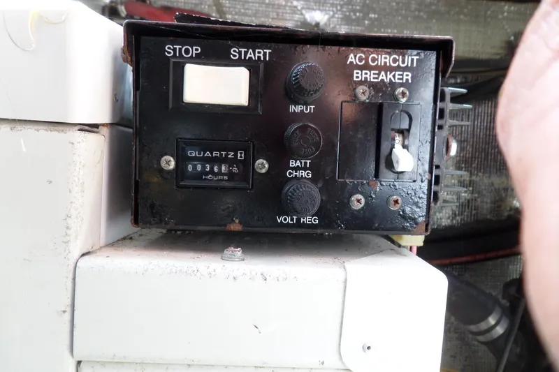 Slide: The Image of Control panel of 2005 Chaparral Signature 270 boat with hour meter and circuit breaker. - 57