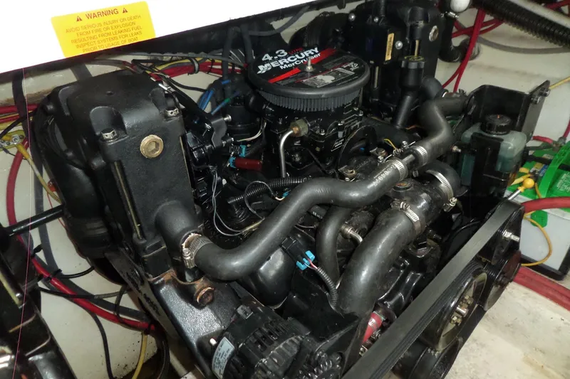 Slide: The Image of Engine of 2005 Chaparral Signature 270 boat, featuring Mercury components. - 58