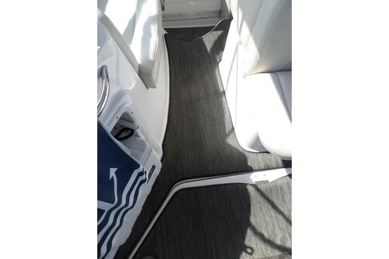 Slide: The Image of Interior view of 2005 Chaparral Signature 270 boat with carpeted flooring and seating. - 61
