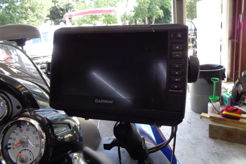Slide: The Image of Garmin GPS on 2018 Bass Tracker PT175 boat dashboard in a garage setting. - 13