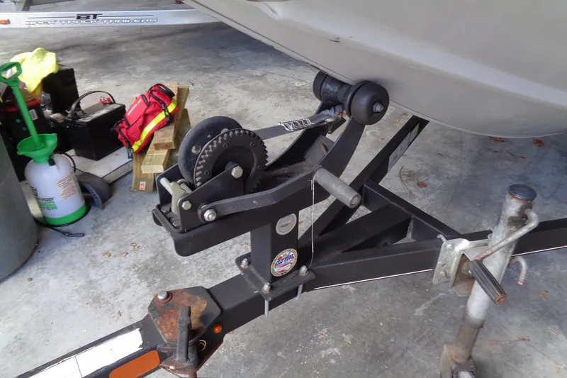 Slide: The Image of 2018 Bass Tracker PT175 trailer hitch and winch in a garage setting. - 17