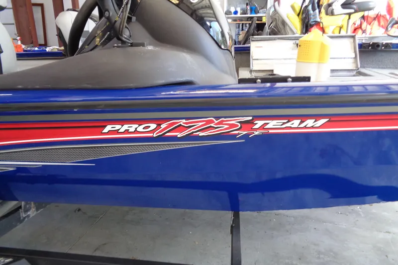 Slide: The Image of 2018 Bass Tracker PT175 boat with "Pro 175 Team" decal, blue and red design. - 3