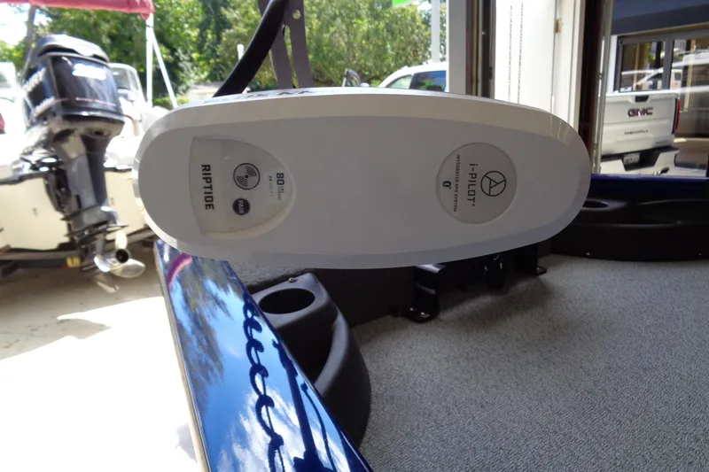 Slide: The Image of 2018 Bass Tracker PT175 with Riptide i-Pilot trolling motor in a garage setting. - 6