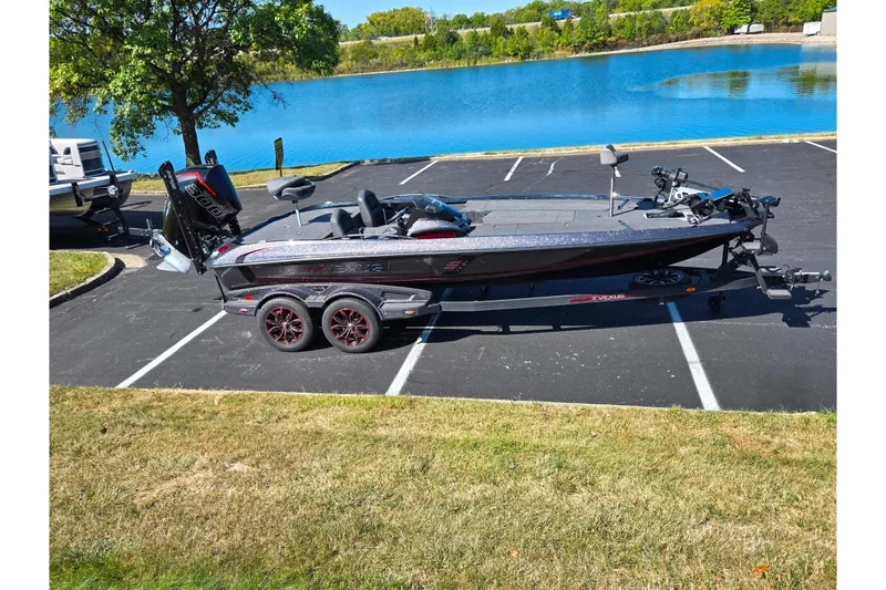 The Image of 2025 Vexus VX21 boat parked near a scenic lake on a sunny day. - 0