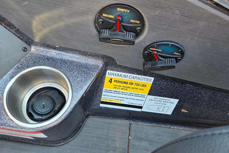 Slide: The Image of 2025 Vexus VX21 boat dashboard with capacity label and control switches. - 17