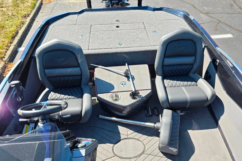 Slide: The Image of 2025 Vexus VX21 boat interior with two cushioned seats and steering wheel. - 23