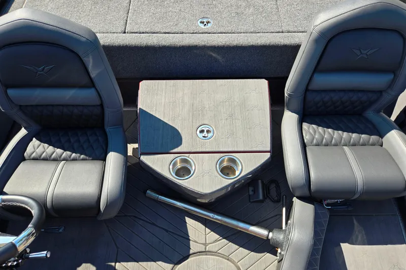 Slide: The Image of 2025 Vexus VX21 boat interior with two black seats and a central console. - 24