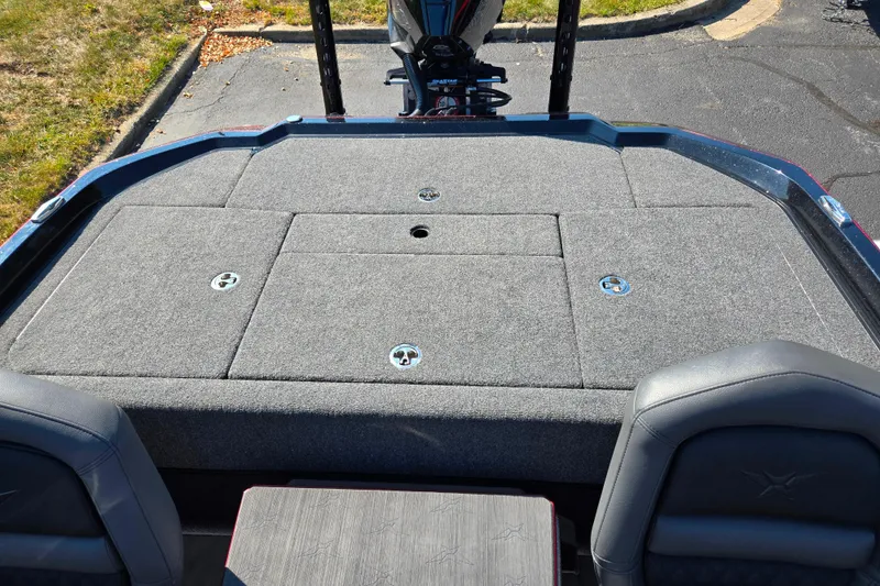 Slide: The Image of 2025 Vexus VX21 boat deck with gray carpet and storage compartments. - 26