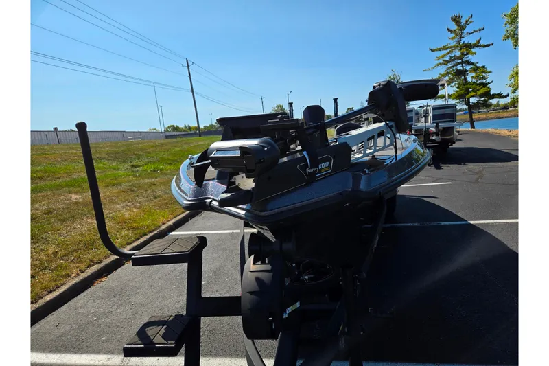 Slide: The Image of 2025 Vexus VX21 boat on trailer in parking lot, sunny day. - 4