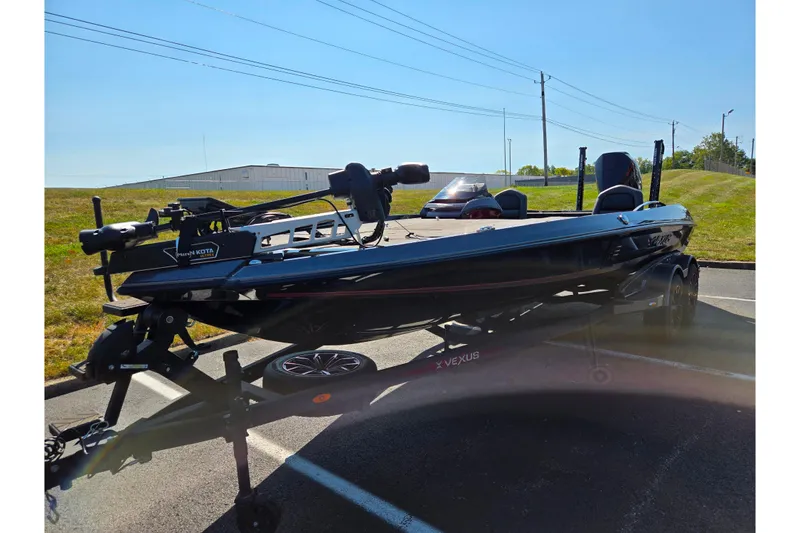 Slide: The Image of 2025 Vexus VX21 boat on trailer in sunny outdoor setting. - 5