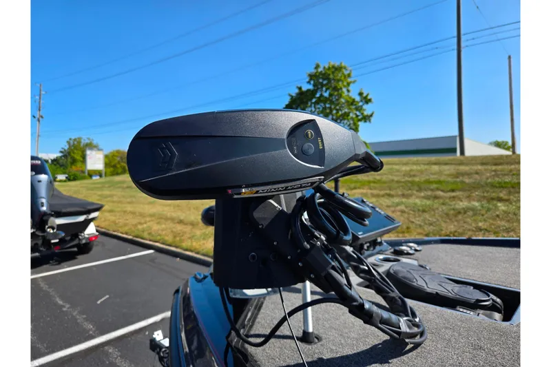 Slide: The Image of 2025 Vexus VX21 boat with advanced trolling motor in a parking lot. - 6