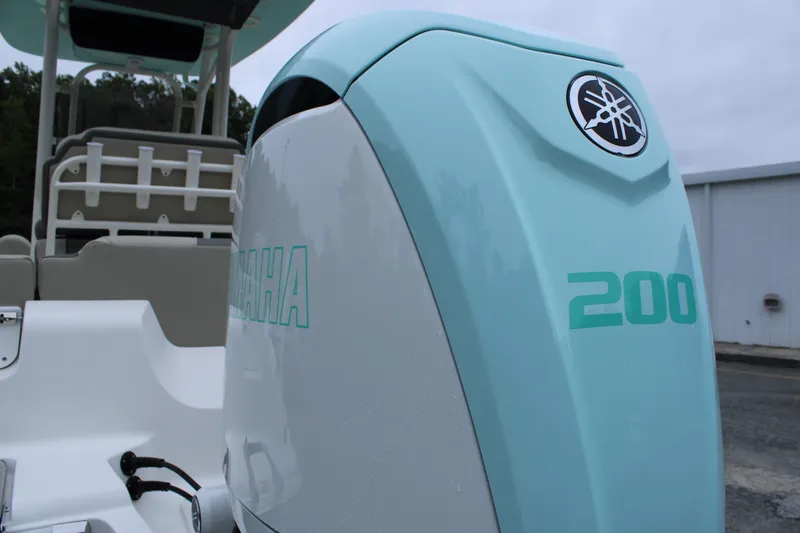 Slide: The Image of 2026 Key West 219 FS boat with Yamaha 200 engine, light blue and white design. - 11
