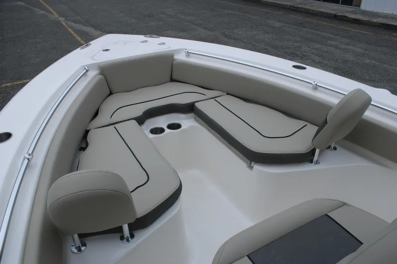 Slide: The Image of 2026 Key West 219 FS boat interior with cushioned seating and cup holders. - 15