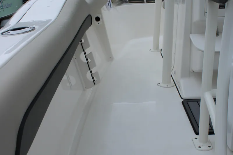 Slide: The Image of 2026 Key West 219 FS boat interior, showcasing sleek white deck and modern design. - 19