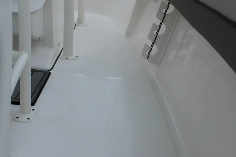 Slide: The Image of 2026 Key West 219 FS boat interior, featuring sleek white deck and seating area. - 20