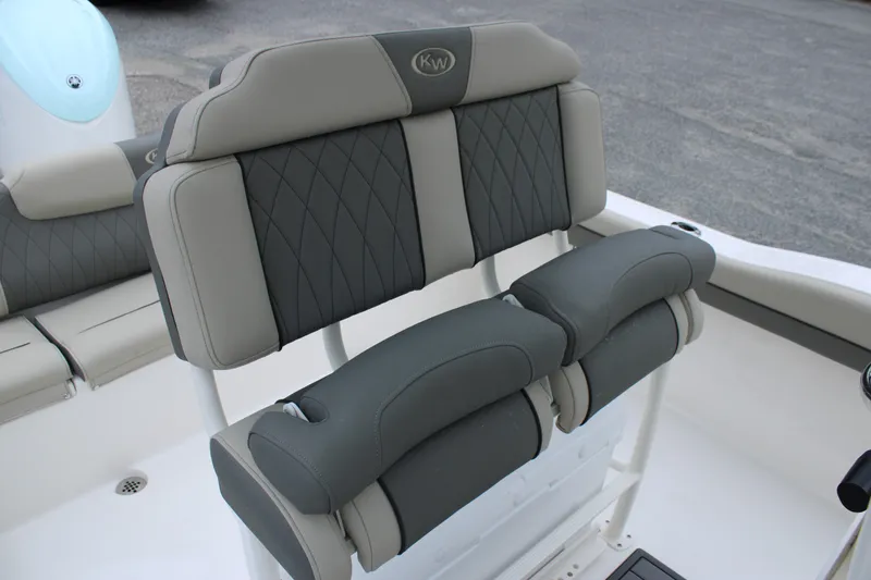 Slide: The Image of 2026 Key West 219 FS boat seating with gray and beige upholstery. - 24