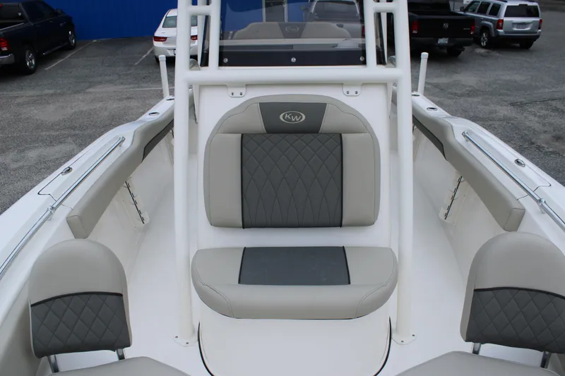 Slide: The Image of 2026 Key West 219 FS boat interior with gray seating and diamond stitching. - 27