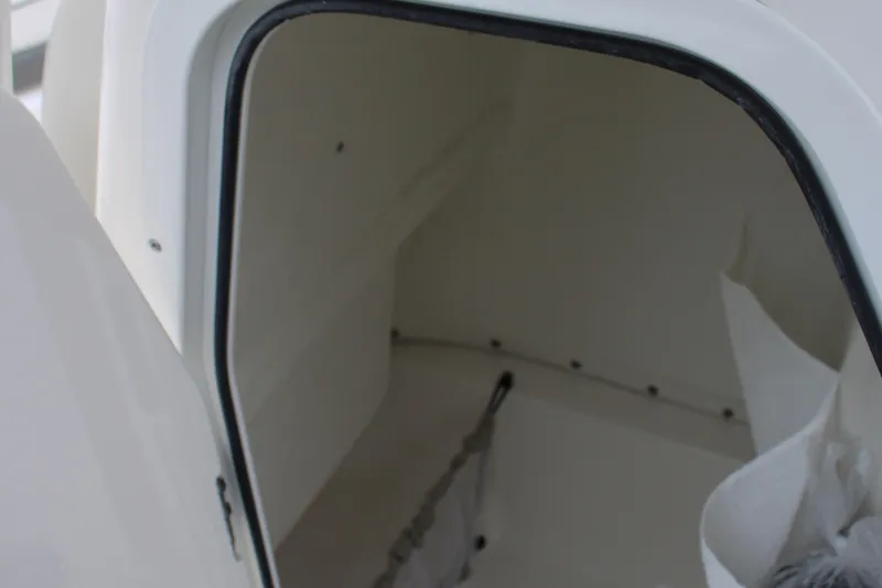 Slide: The Image of Open storage compartment on 2026 Key West 219 FS boat. - 30
