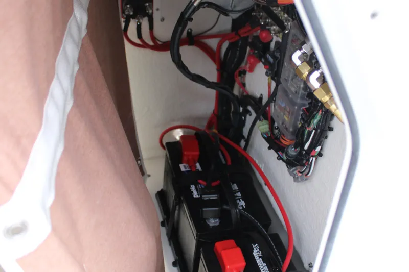 Slide: The Image of Electrical wiring and battery setup inside a 2026 Key West 219 FS boat. - 31