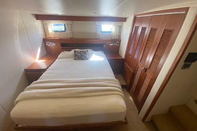 Slide: The Image of Cozy bedroom in 1980 Willard Marine Pilothouse with wood accents and natural light. - 19