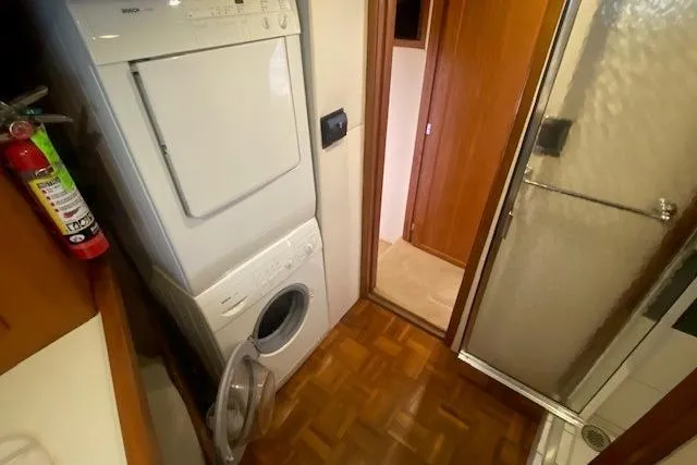 Slide: The Image of Laundry area in 1980 Willard Marine Pilothouse with washer, dryer, and shower. - 27