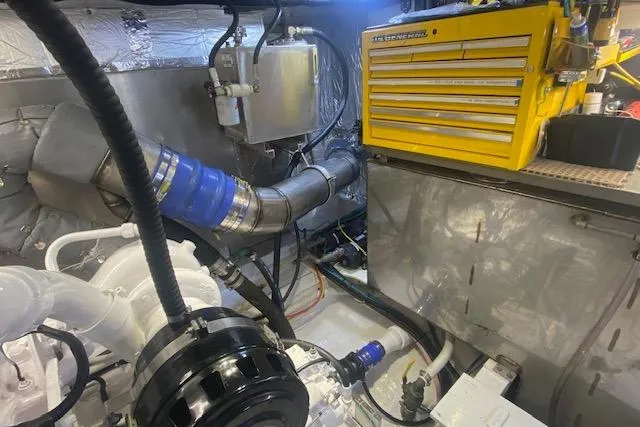 Slide: The Image of Engine room of 1980 Willard Marine Pilothouse with tools and machinery. - 36