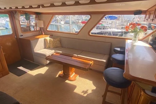 Slide: The Image of Interior of 1980 Willard Marine Pilothouse with cozy seating and harbor view. - 6