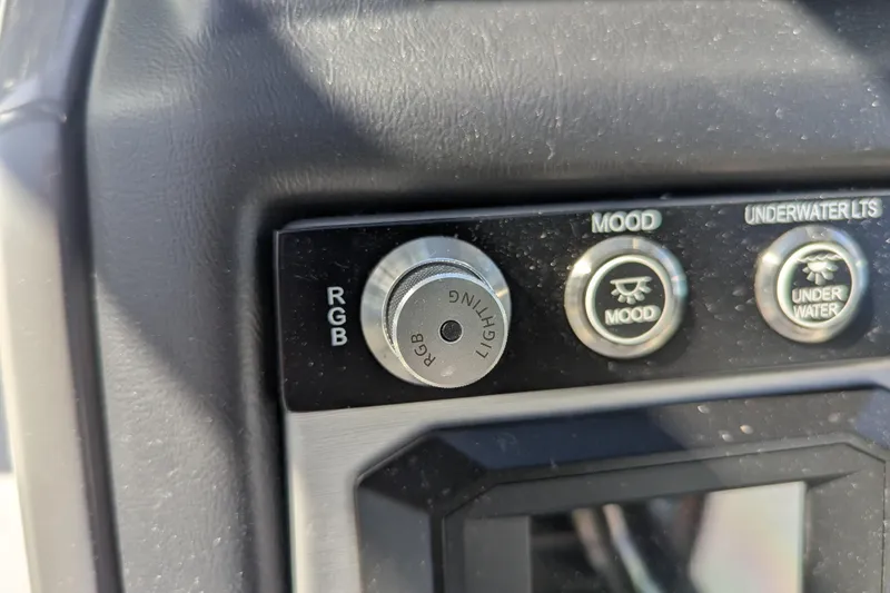 Slide: The Image of Control panel of 2026 Trifecta 25RF SS with RGB lighting and mood settings. - 5