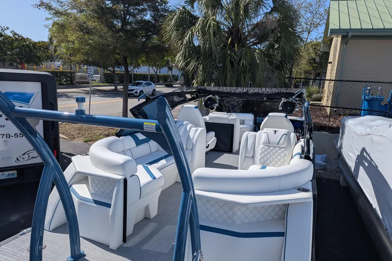 Slide: The Image of 2026 Trifecta 25RF SS pontoon boat with luxurious white seating and modern design. - 8