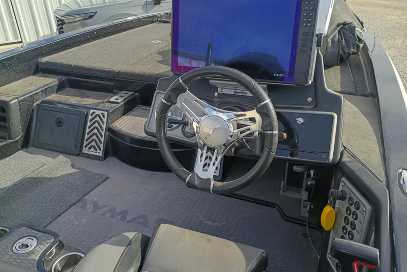Slide: The Image of 2021 Caymas CX20 boat cockpit with steering wheel and electronic display. - 10