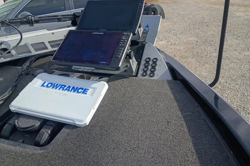 Slide: The Image of 2021 Caymas CX20 boat dashboard with Lowrance HDS fishfinder and control panel. - 11