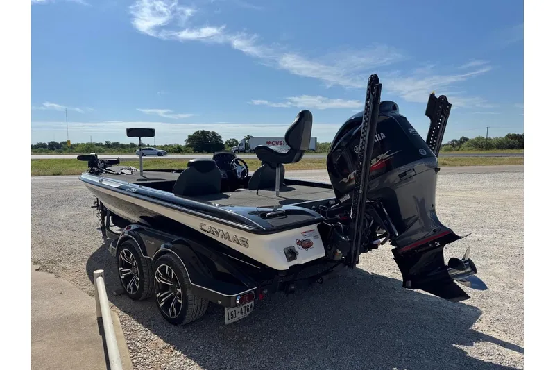 Slide: The Image of 2021 Caymas CX20 boat with Yamaha engine on a trailer, parked outdoors. - 3