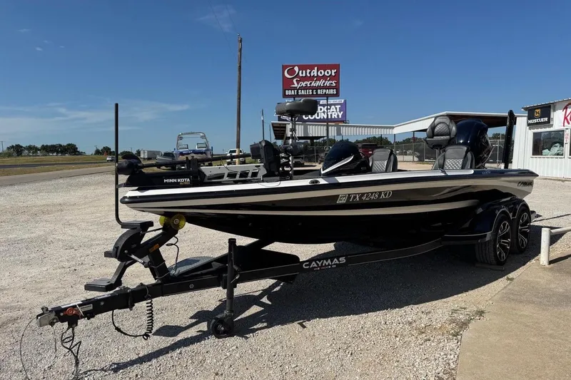 Slide: The Image of 2021 Caymas CX20 boat on trailer at outdoor dealership. - 5