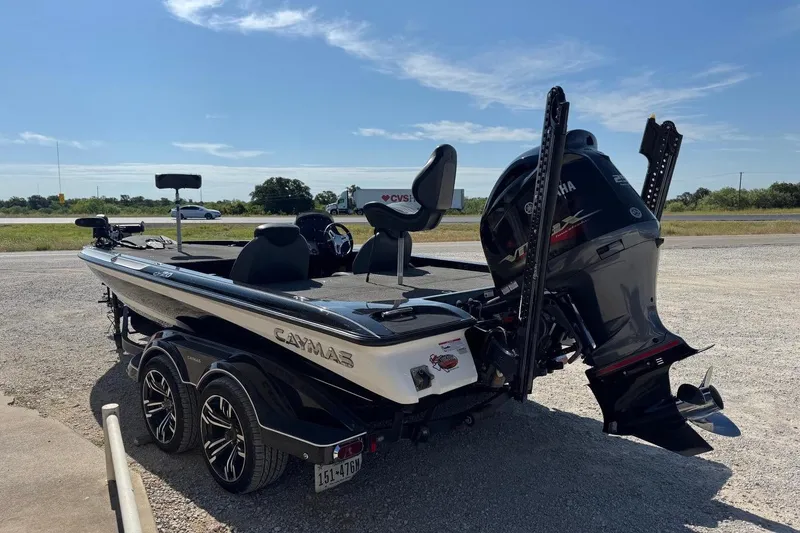 Slide: The Image of 2021 Caymas CX20 boat with Yamaha engine on a trailer, parked outdoors. - 6