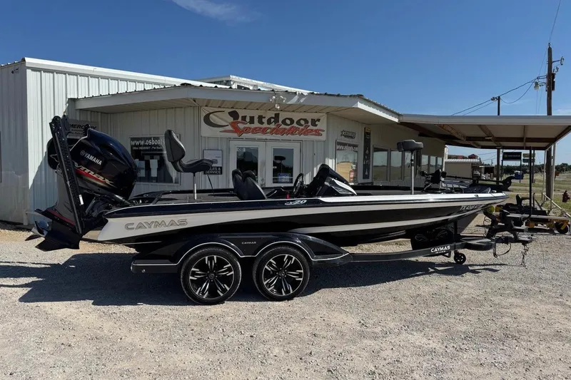Slide: The Image of 2021 Caymas CX20 boat with Yamaha engine parked outside dealership. - 7