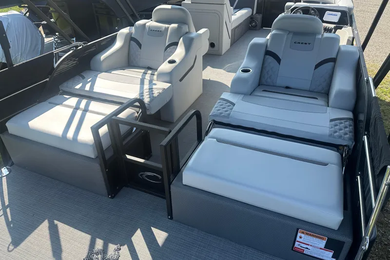 Slide: The Image of 2025 Crest Classic 220 boat interior with luxurious seating and modern design. - 17