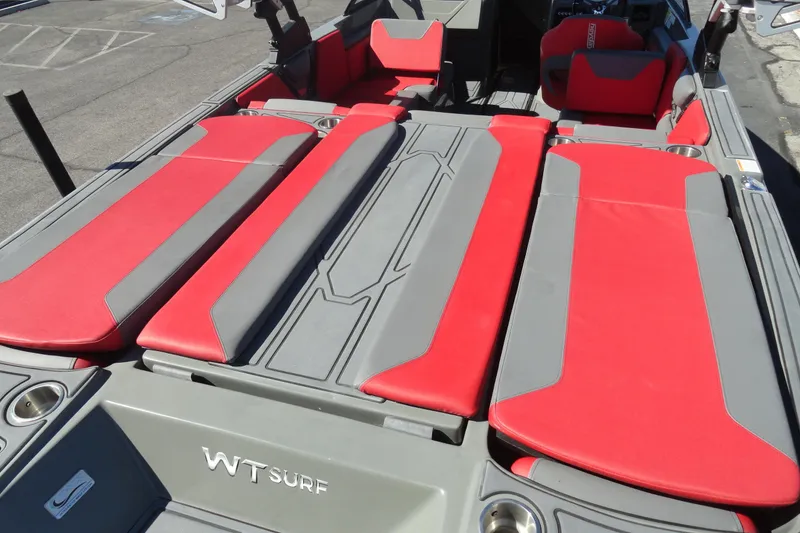 Slide: The Image of 2022 Heyday WT Surf boat interior with red and gray seating, showcasing modern design. - 23