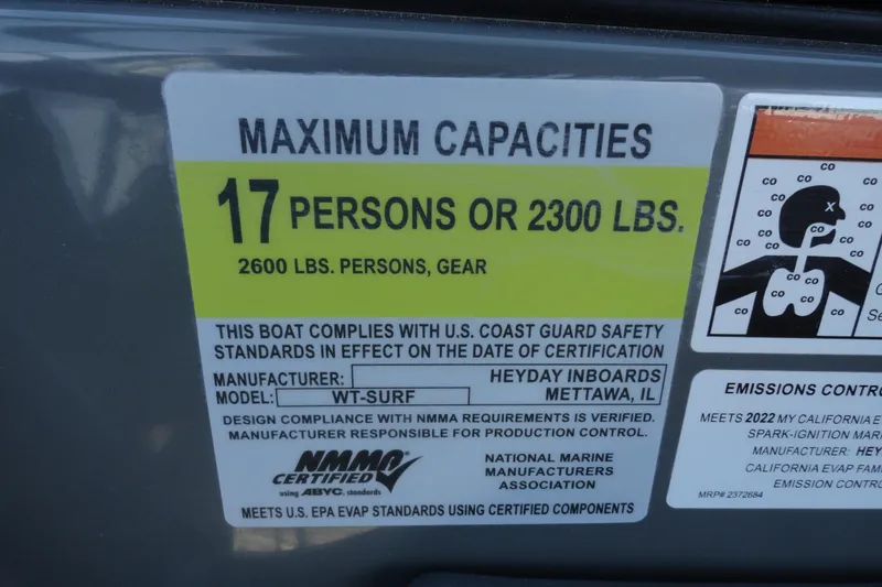 Slide: The Image of 2022 Heyday WT Surf boat capacity label, 17 persons or 2300 lbs, safety compliance. - 13