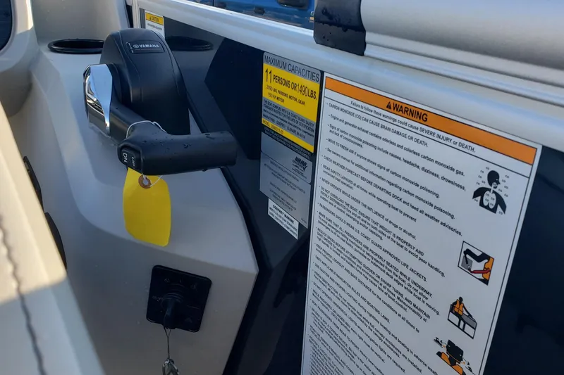 Slide: The Image of Control panel of 2026 Godfrey 2086C SE boat with safety warnings and capacity details. - 6